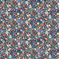 Patterned fabric with colorful floral design on a dark blue cotton quilting fabric