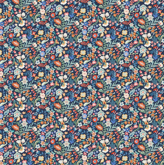 Patterned fabric with colorful floral design on a dark blue cotton quilting fabric