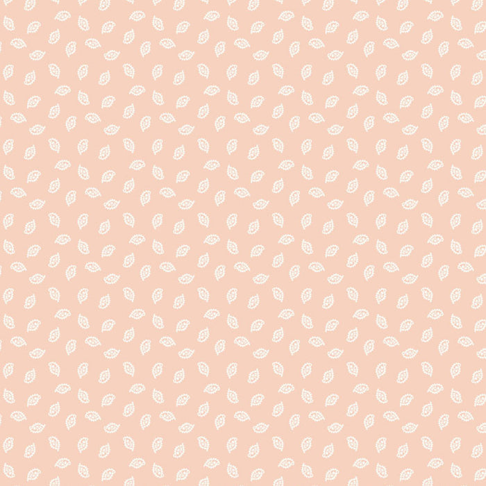 Pattern of small white dots on a light pink cotton quilting fabric