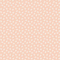 Pattern of small white dots on a light pink cotton quilting fabric