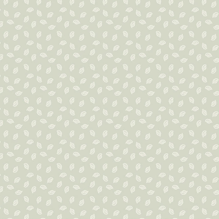 Patterned cotton quilting fabric with small white leaves on a light gray background