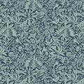 Patterned fabric with green leaves and birds on a dark blue cotton quilting fabric