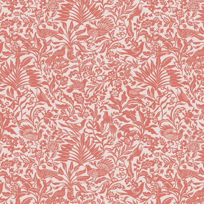 Patterned fabric with red floral and bird design on a light pink cotton quilting fabric