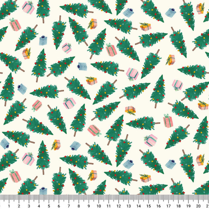 A repeating Christmas-themed pattern on a cream cotton quilting fabric featuring green Christmas trees with red ornaments and wrapped presents in pink, blue, yellow, and white. A ruler scale is visible along the bottom edge.