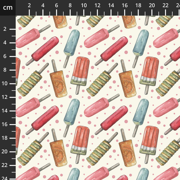 Pattern of colorful ice lollies on a white cotton quilting fabric with a ruler for scale.