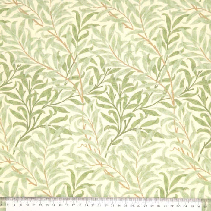 William Morris willow bough design in sage green, printed on a cotton fabric with a cm ruler