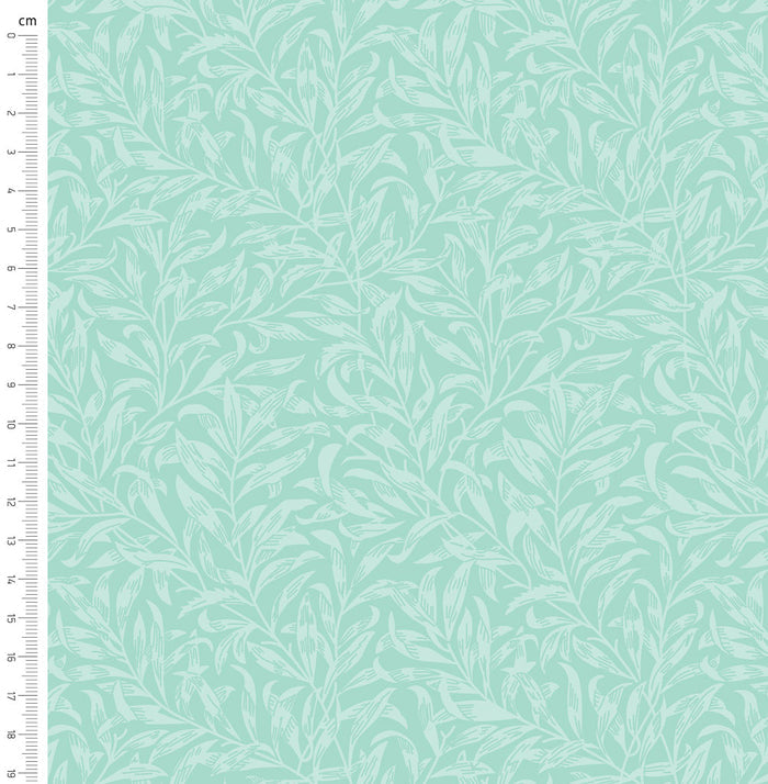 Seafoam green willow bough design printed on quilting fabric with a cm ruler